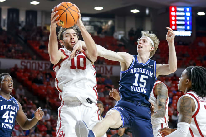 Sam Godwin being fouled by BYU's Richie Saunders