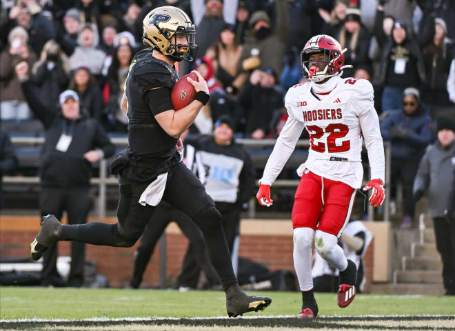 Nov 25, 2023; West Lafayette, Indiana, USA; Purdue Boilermakers quarterback Hudson Card (1) runs for a touchdown past Indiana Hoosiers defensive back Jamari Sharpe (22) during the second half at Ross-Ade Stadium. Mandatory Credit: Robert Goddin-USA TODAY Sports