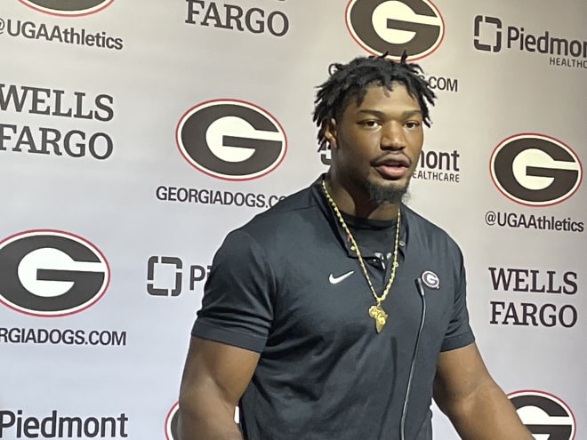 MJ Sherman with his gold necklace. Photo by Jed May. 