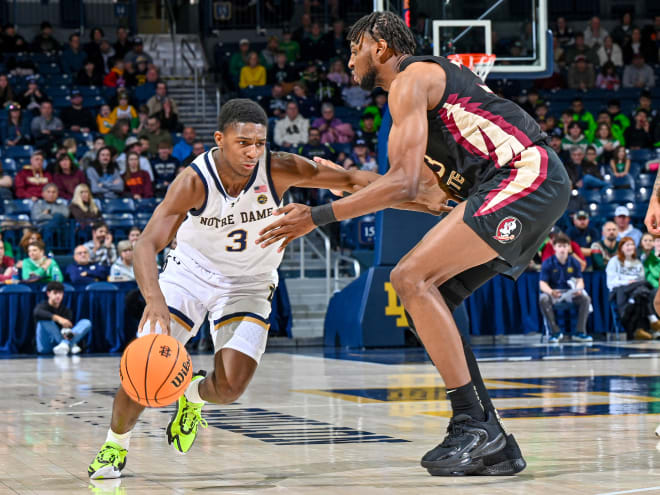 Markus Burton, who scored 20 points for Notre Dame in a 67-58 loss to Florida State, tries to drive past 6-foot-10 forward Jaylan Gainey.