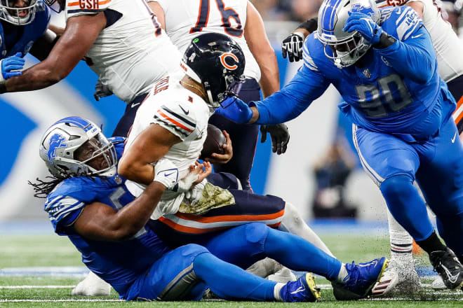 Former NC State defensive lineman Alim McNeill of the Detroit Lions tackles Chicago Bears quarterback Justin Fields last Sunday.