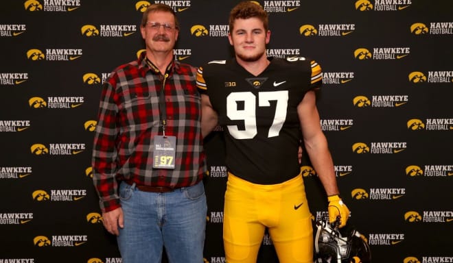 Zach VanValkenburg with his father, Dale, on their official visit to Iowa in January.