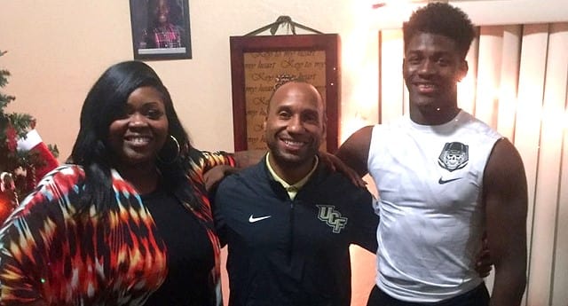 Dontay Mayfield, seen here with his mother during a Dec. 2015 home visit with Troy Walters.