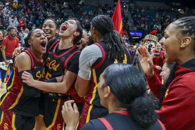 USC's Kayla Williams, left, and Kayla Padilla, second from left, celebrated after defeating Stanford in the Pac-12 championship game Sunday.