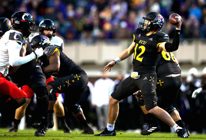 ECU quarterback Holton Ahlers loads up for a pass in the first half of Friday's game with Cincinnati.