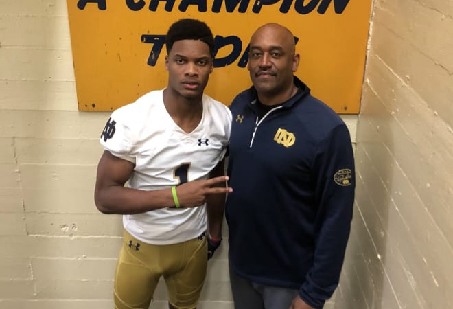 Notre Dame receivers coach Del Alexander with prized five-star recruit Jordan Johnson.