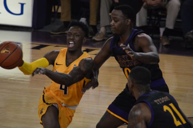 Wichita State's Samaj Haynes-Jones operates against ECU's Isaac Fleming in Thursday night's 95-60 victory.