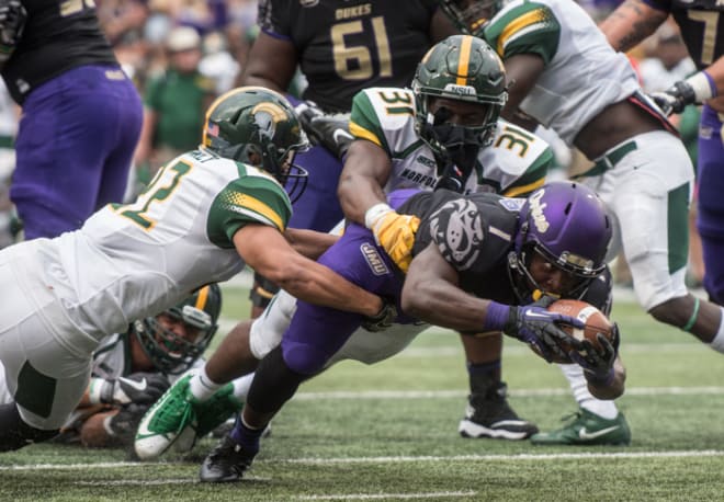 James Madison running back Trai Sharp (1) lunges forward during the Dukes' 75-14 victory over Norfolk State on Saturday at Bridgeforth Stadium. 