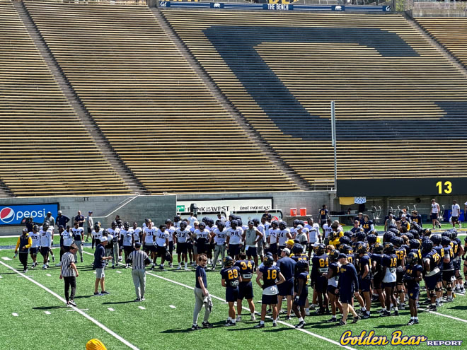 Justin Wilcox addresses his team during Sunday's training camp practice inside Memorial Stadium.