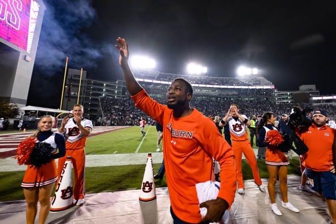 Cadillac waves to the Auburn crowd