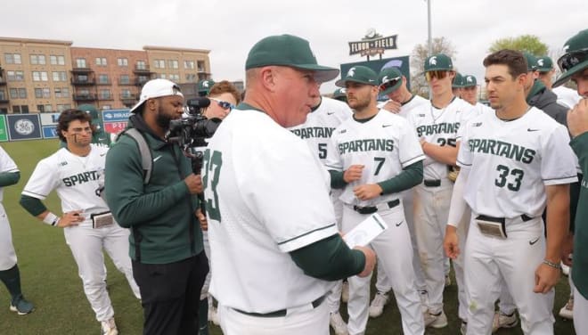 Michigan State head coach Jake Boss talks to his team