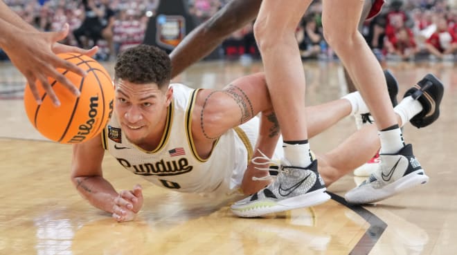 Mason Gillis dives for a ball during a Final Four win against N.C. State. 