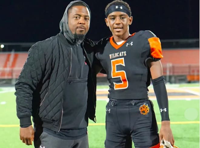 Wisconsin cornerbacks coach Hank Poteat (right) alongside his son, Tre Poteat. 