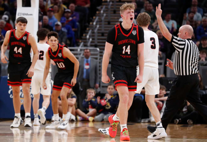 Brownstown Central Braves guard Jack Benter (14) celebrates after making a buzzer-beater during the IHSAA Class 2A boy’s basketball state championship against the Wapahani Raiders, Saturday, March 30, 2024, at Gainbridge Fieldhouse in Indianapolis.