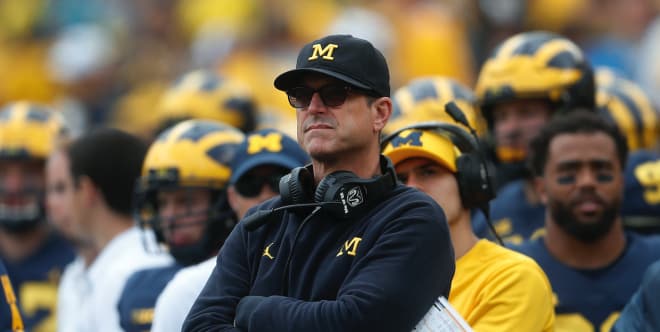 Michigan Wolverines Football Coach Jim Harbaugh and his team won't face Ohio State Saturday.