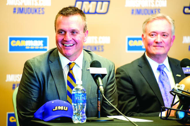 Mike Houston (left) and JMU athletic director Jeff Bourne