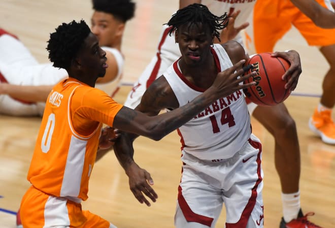 Alabama Crimson Tide guard Keon Ellis (14) grabs a rebound after missed free throws by Tennessee Volunteers guard Davonte Gaines (0) during the second half at Bridgestone Arena. Photo | USA TODAY