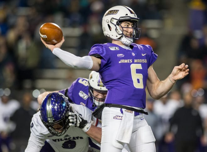 James Madison quarterback Ben DiNucci throws a pass during the Dukes' win over Weber State in the national semifinals last month at Bridgeforth Stadium.