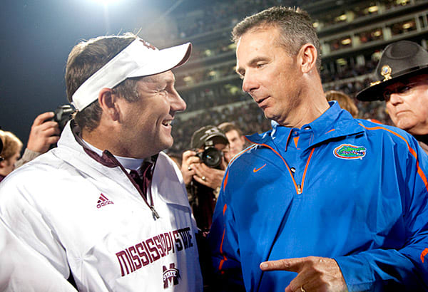 Urban Meyer (left) with Dan Mullen, then the coach at MSU, following their matchup in 2009. 