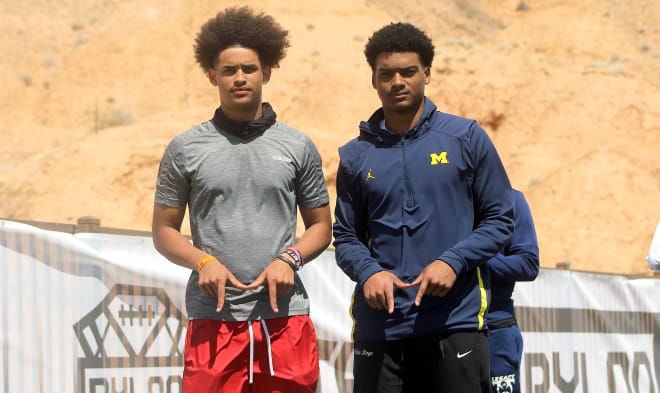 Top 2023 quarterback Dante Moore and five-star Michigan Wolverines football recruiting cornerback Will Johnson pose for a photo. 