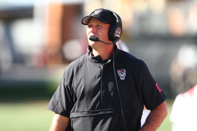 NC State Wolfpack football head coach Dave Doeren watches from the sideline.