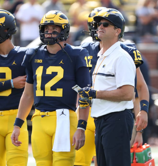 Michigan Wolverines quarterback Cade McNamara and coach Jim Harbaugh