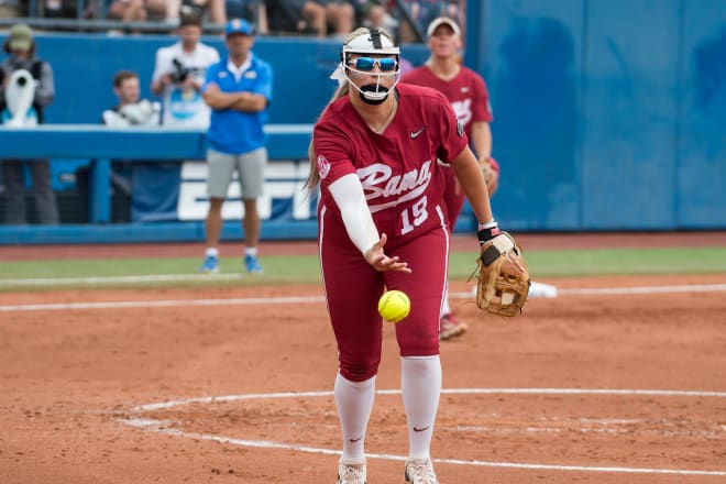 Alabama Crimson Tide starting pitcher Kayla Beaver (19) throws the ball to first base for an out in the second inning against the UCLA Bruins during a Women's College World Series softball game at Devon Park. Photo | Brett Rojo-USA TODAY Sports