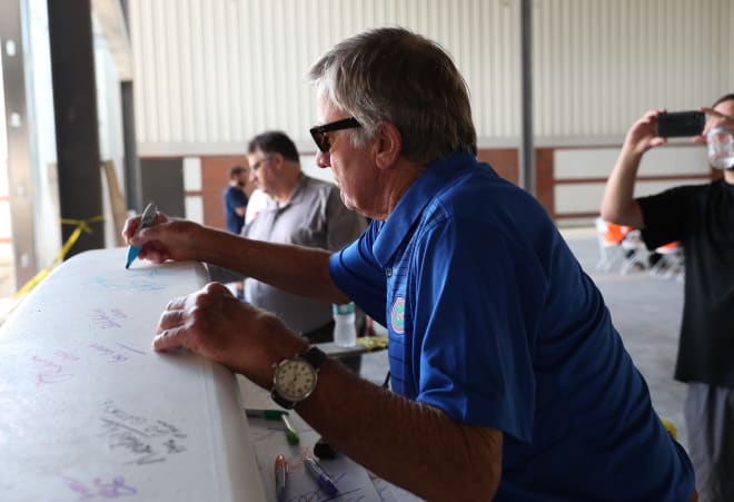 Steve Spurrier signs the final beam before it's put into place at the James W. “Bill” Heavener Football Training Center