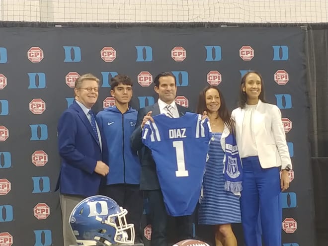 From left, Duke president Vincent E. Price, Manny Diaz Jr., Manny Diaz, Stephanie Diaz, and athletics director Nina King pose after Saturday's press conference. 