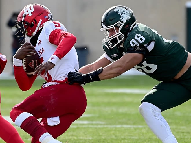  Michigan State Spartans defensive end Avery Dunn (98) catches Indiana Hoosiers quarterback Dexter Williams II (5) behind the line for a loss at Spartan Stadium during last year's contest.