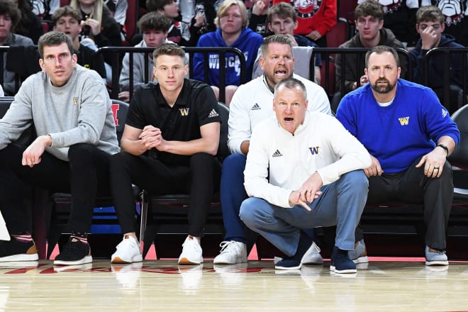 Backed by his elite coaching staff and a talented team bent on making amends Wahoo's Kevin Scheef (front) has been named Huskerland's Class C-1 boys basketball coach of the year.