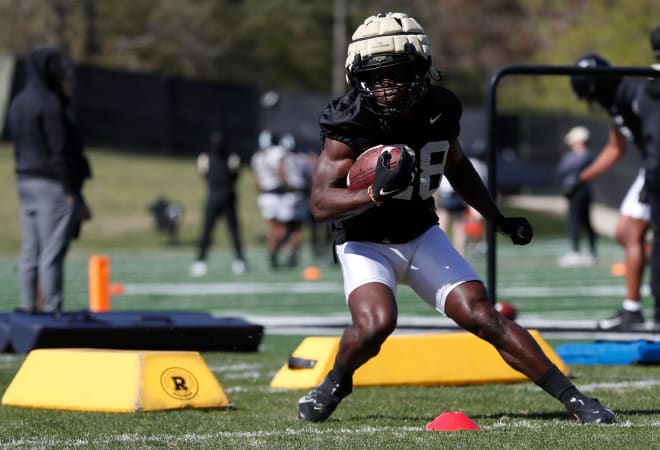 Purdue Boilermakers running back Addai Lewellen (28) runs a drill during Purdue football practice, Tuesday, April 18, 2023, at Purdue University in West Lafayette, Ind.
