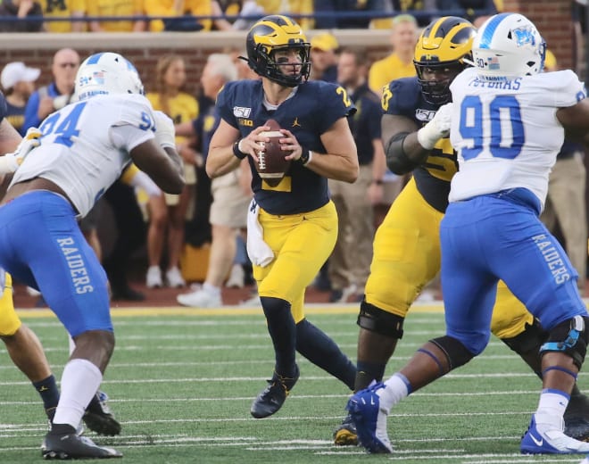 Michigan Wolverines football senior quarterback Shea Patterson threw for 197 yards in the first half on Saturday night.