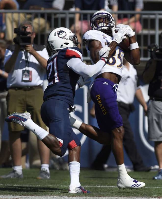 ECU's Davon Grayson nabs a pass reception over UConn's Jamar Summers in a 41-38 victory.
