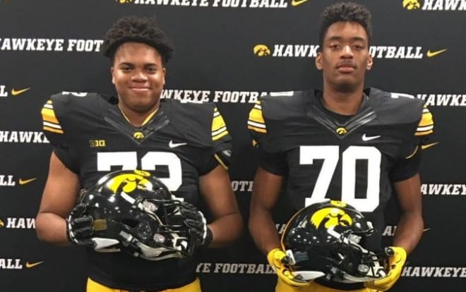 Bryce Mostella (#70 on the right) with teammate Dallas Fincher (#72) at Iowa on Sunday.