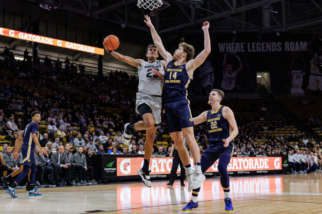 Tristan da Silva drives to the glass against Brock Wisne on Dec. 18