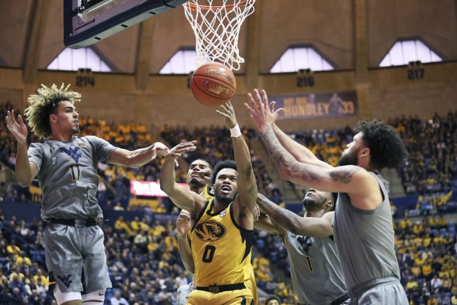 The West Virginia Mountaineers outscored Missouri, 50-28, in the second half.