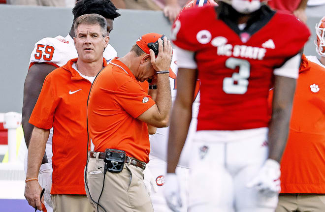 A frustrated Dabo Swinney walks the sideline in Carter-Finley Stadium Saturday during Clemson's matchup with N.C. State.