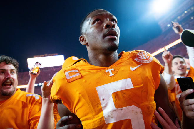 Tennessee quarterback Hendon Hooker looks on amid the on-field celebration that ensued following the Vols' 52-49 win over Alabama. 