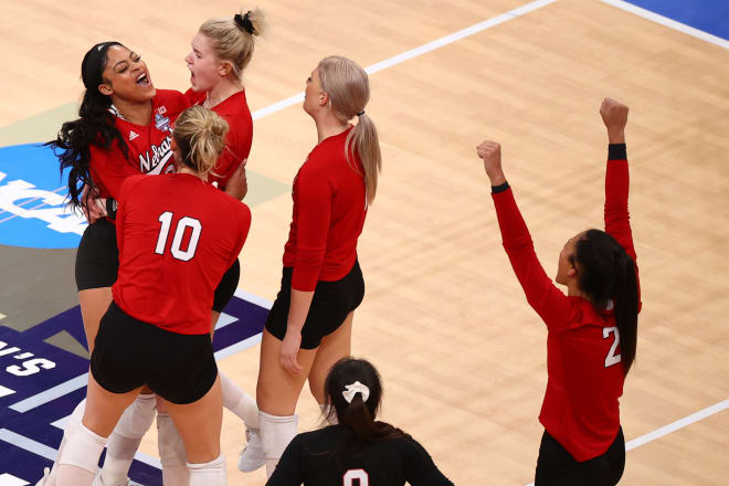 Nebraska volleyball celebrates a point in a hard fought national championship match
