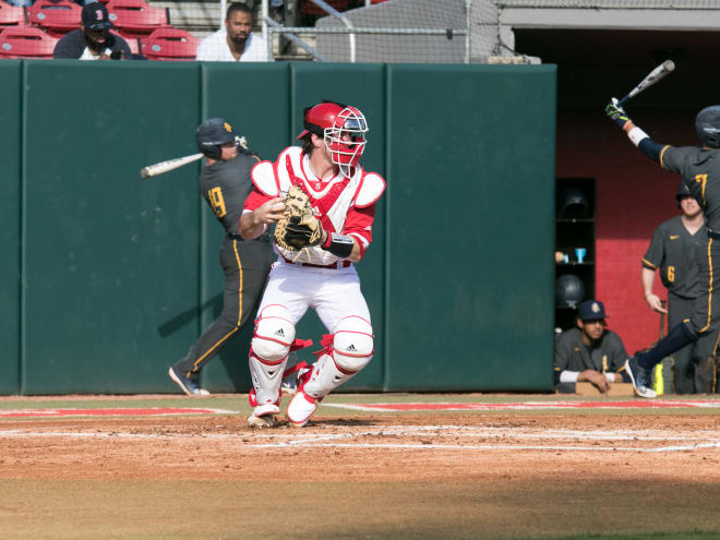 NC State baseball catcher Patrick Bailey throws to second base.