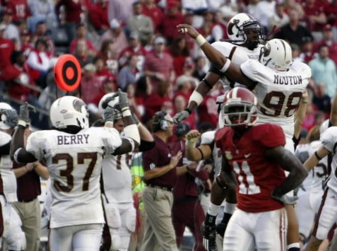 Alabama's Matt Caddell (11) looks on in disbelief as players from Louisiana-Monroe celebrate a 21-14 victory at Bryant-Denny Stadium. Photo | Butch Dill The Associated Press