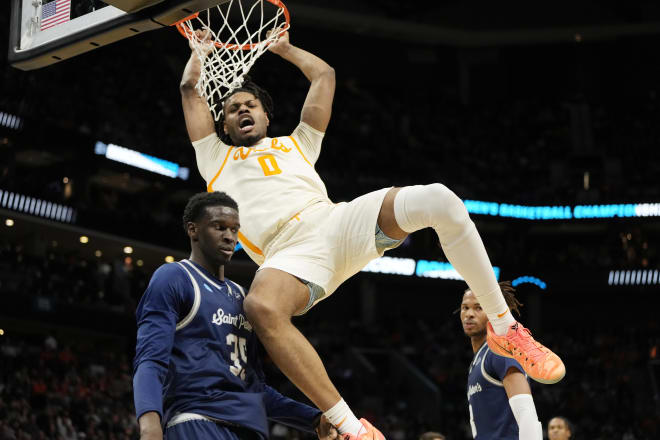 Mar 21, 2024; Charlotte, NC, USA; Tennessee Volunteers forward Jonas Aidoo (0) dunks the ball over Tennessee Volunteers forward Mouhamed Sow (35) in the first half of the first round of the 2024 NCAA Tournament at Spectrum Center.