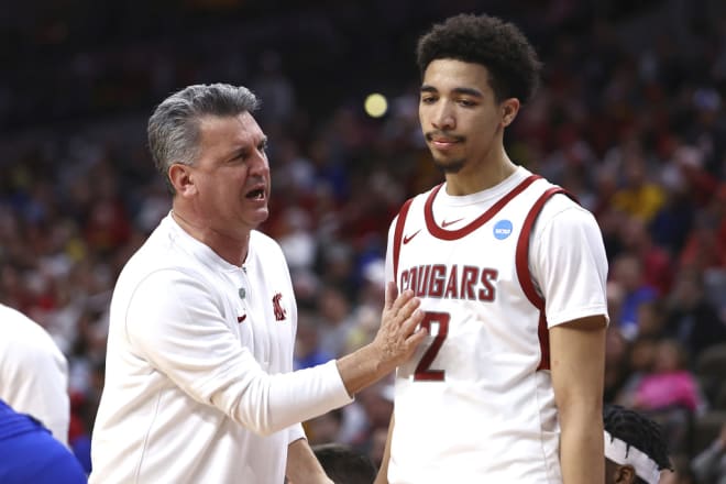 Kyle Smith talks with Myles Rice during Washington's State NCAA Tournament game against Drake.