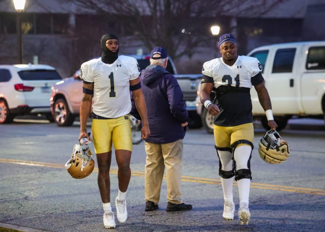 Defensive ends Javontae Jean-Baptiste (1) and Nana Osafo-Mensah (31) on their way to Notre Dame's first practice of the spring, on Wednesday.