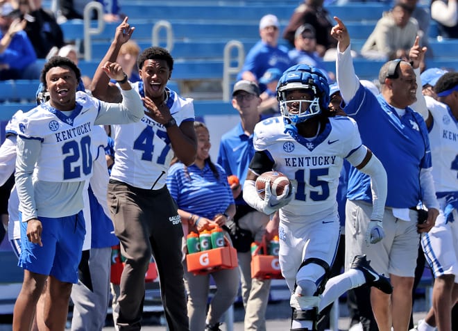 Kentucky's defensive players and coaches celebrated as redshirt freshman corner Jaremiah Anglin intercepted a pass and returned it for a touchdown on the final play of the Wildcats' Blue-White Spring Game on Saturday at Kroger Field.