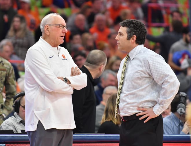 Georgia Tech coach Josh Pastner, right, talks with Syracuse coach Jim Boeheim. 