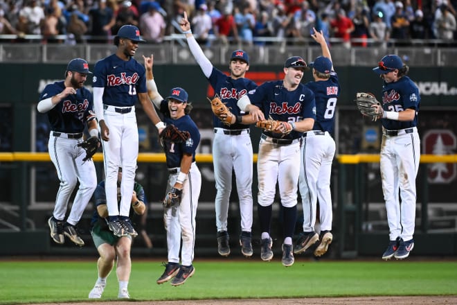 Ole Miss players celebrate following Saturday's Game 1 CWS Finals win over Oklahoma. 