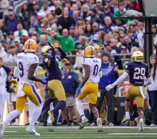 Notre Dame safety Xavier Watts (0 in blue) tracks one of his two interceptions he has Saturday against Pitt.