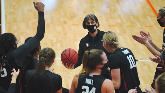 Tara VanDerveer celebrates with her team after Stanford defeated Pacific 104-61 to earn the Hall of Fame head coach her 1,099th career win.